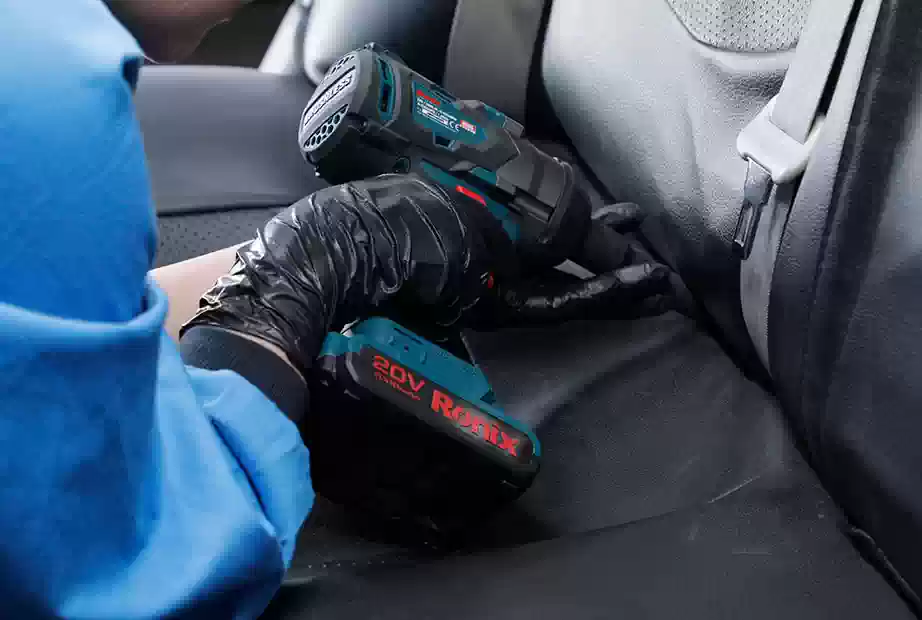 Using a Ronix impact driver to fix a car