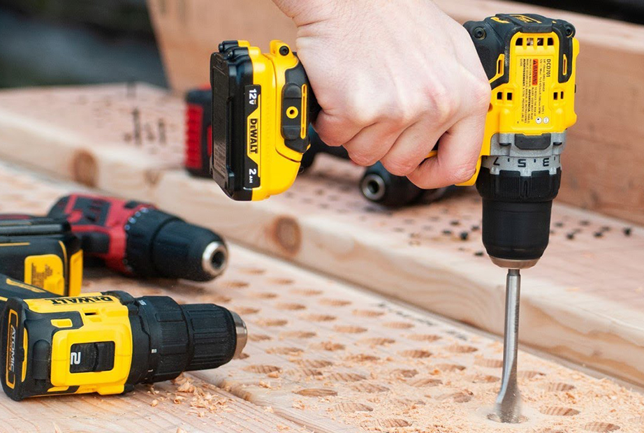 Drilling holes into wood using a DeWalt cordless drill