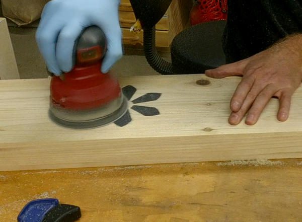 Sand the inlay down flat with an orbital sander