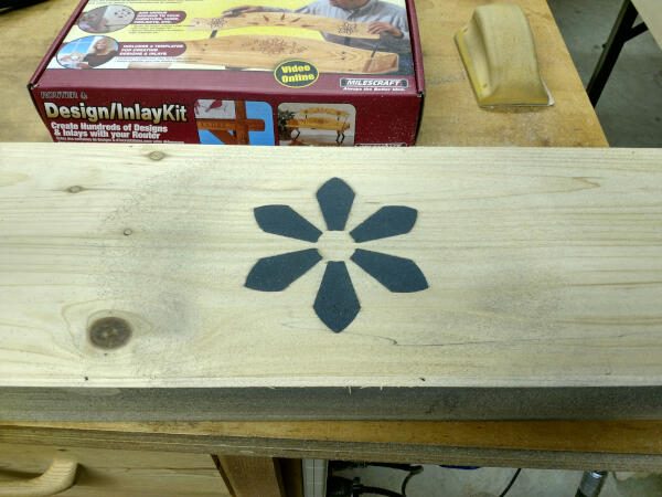 Sanding your wood inlay with a power sander and vacuum gives this result